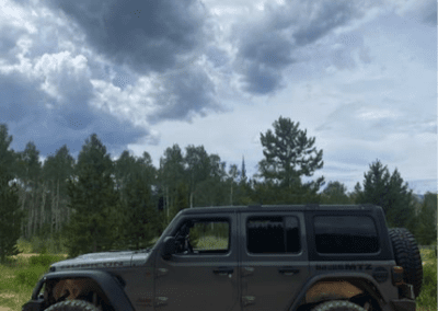 Side view of the rented Jeep off the side of the ATV trail.