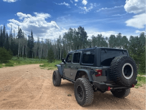 Jeep Parked at look out point on road to Mirror Lake in Utah.